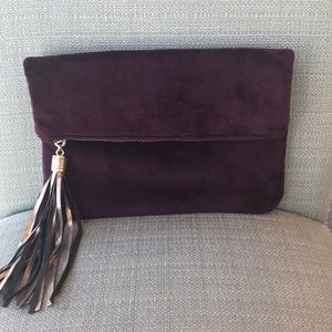 Velvet fold-over clutch with metallic tassel